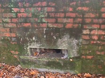 Detail of embrasure and remnants of camouflage.