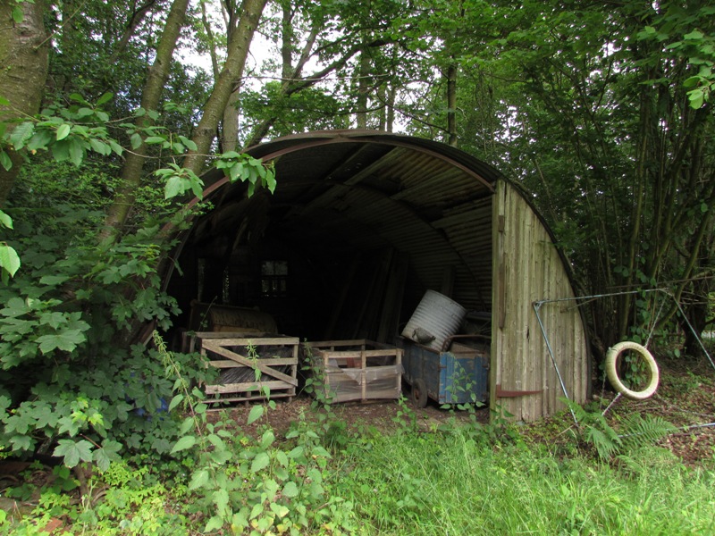 A Nissen hut in use as a farm store