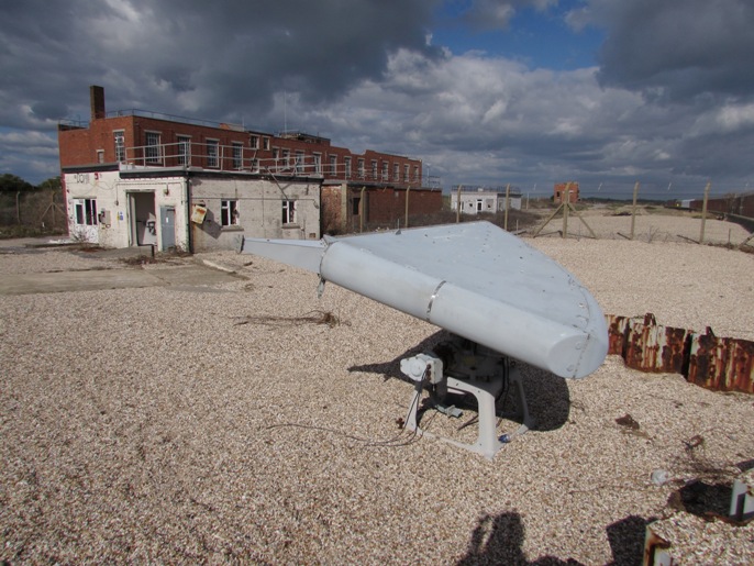 Pedestal antenna with generator house and St. George's Buildings behind
