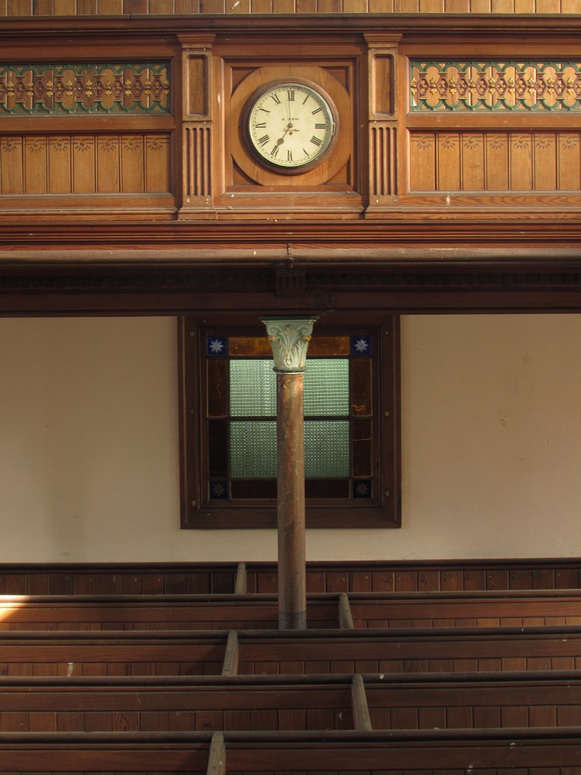 Gallery, clock and pews
