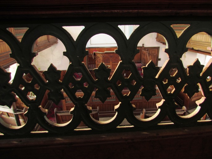 Cast iron panel set in the gallery rail