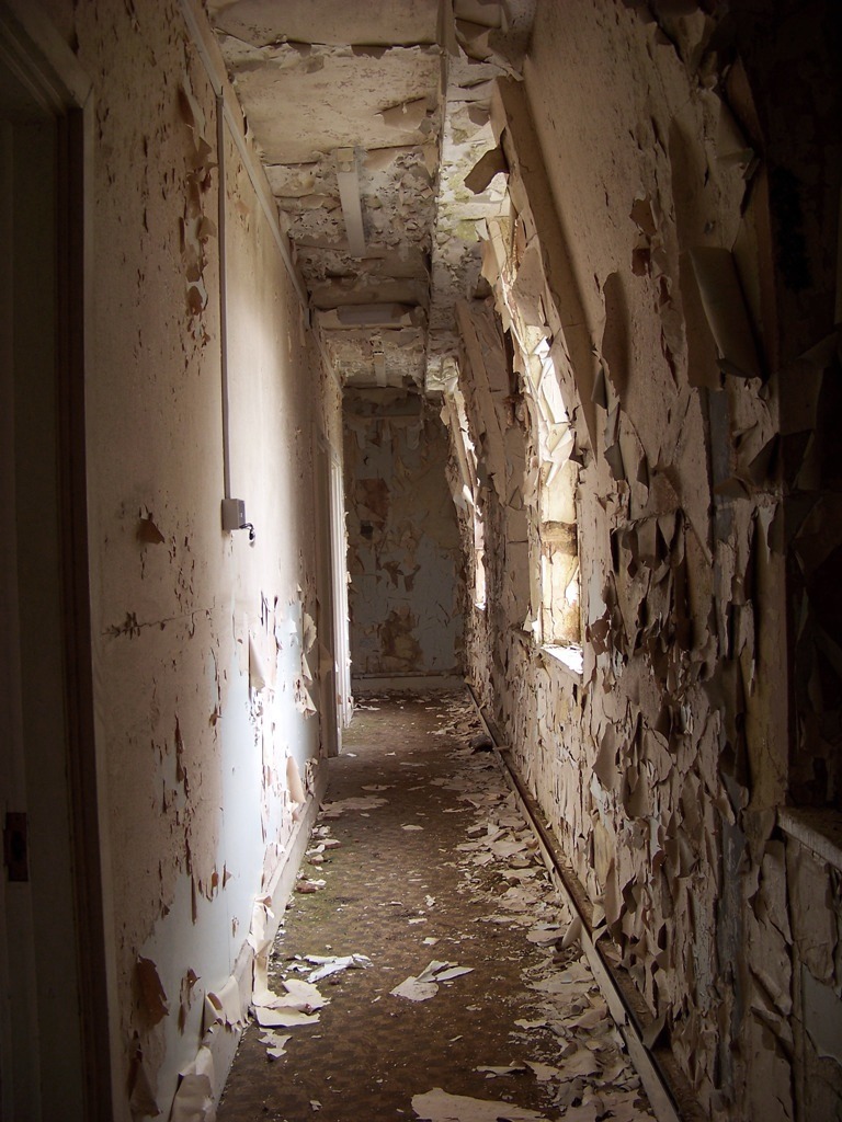 Attic corridors took this unusual shape to fit under the steeply-sloping mansard roofs