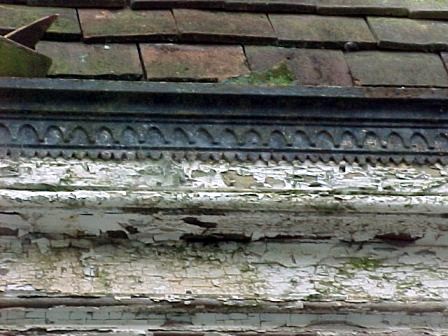 Decorative cast iron gutter.