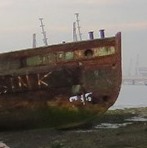 The remains of the  Medina River Chain Ferry, built in 1896 with Vadne and a steam pinnace in the background 